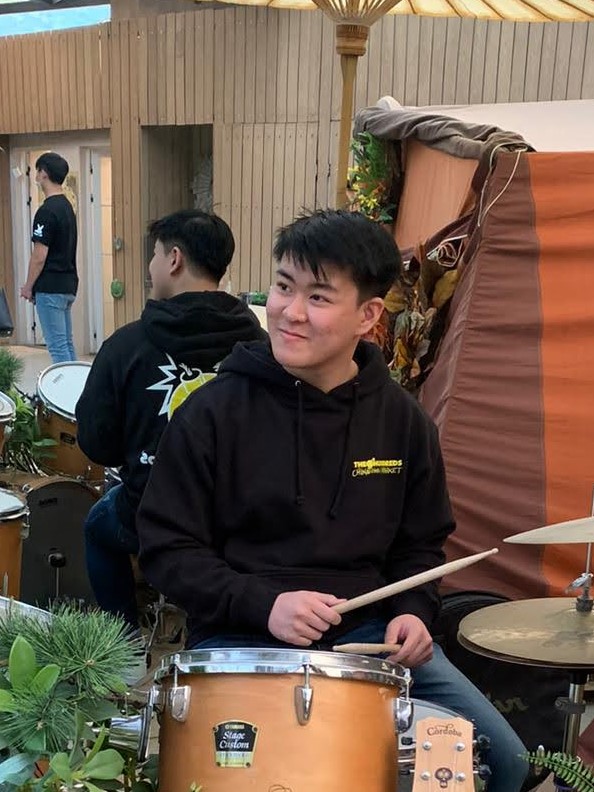 A picture of Raph "playing" the drums